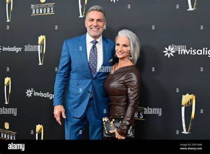 Kurt Warner posing with his wife