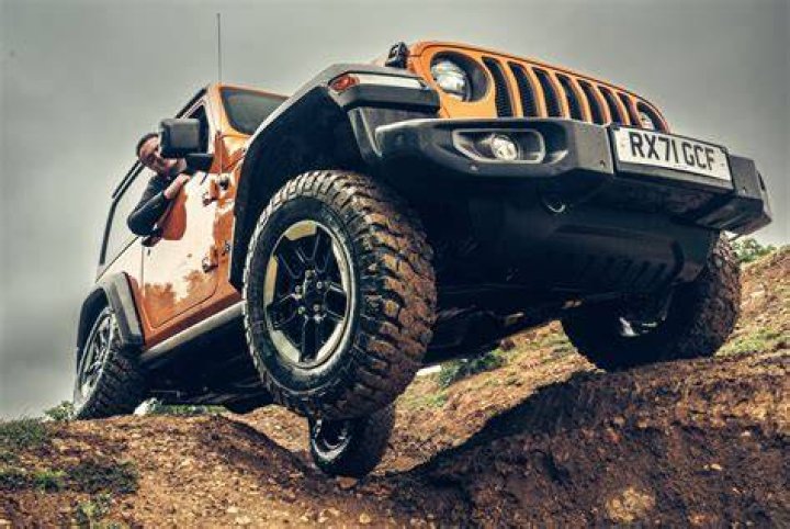Off road vehicle parket atop a sand dune