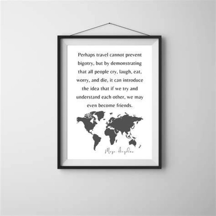 World map with Maya Angelou quote on a turquoise background